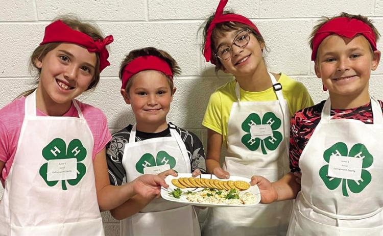 At the District 1 4-H Food Challenge, the Collingsworth County team of Samarra Cantu, left, Keylen Jeffrey, Emma Zaragoza and Claydan Peckler takes fourth place in the Junior Appetizer category. The Food Challenge is described as the kids’ version of the popular television show “Chopped.” Courtesy Photos