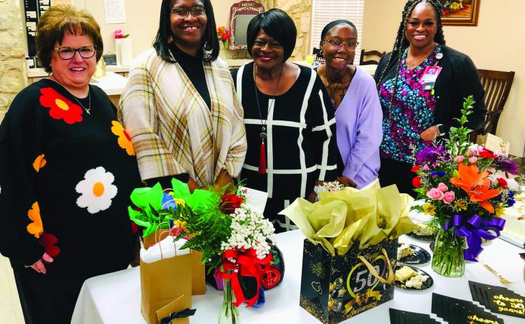 Guest of honor Mary “Cindy” White gathers with her family and Collingsworth General Hospital Administrator Candy Powell during the recent reception in the dining room of Parkview Manor Assisted Living to mark 50 years of service as an incredible nursing assistant. With a “Cheers to 50 Years!” theme, visitors brought gifts, flowers and cards to congratulate White. From left: Powell, daughter Erica Thomas, White, granddaughter Brianna Morning, daughter Brandy Thomas. The Red River Sun/Bev Odom