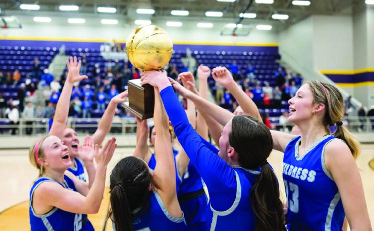 The Childress Lady Cats celebrate a bi-district win over Canadian Monday, Feb. 14. Joe Garcia III/Press Pass Sports