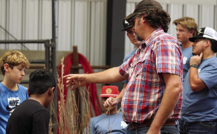 United States Department of Agriculture (USDA) Natural Resources Conservation Service Center Childress District Conservationist Randall Linex teaches students about Texas native grasses during the 25th Annual Childress County Ag Day Thursday, Oct. 24 at the Mashburn Event Center and Arena. The Red River Sun/Elizabeth Tanner