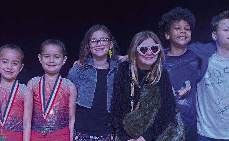 Taking the championship in “Sparklers Got Talent 3.0” is first-grade pianist Blair Ward, left. Second place is the gymnast sister team of kindergartener Vivyan Valles and second-grader Summer Valles. Garnering third place is fourth-grade performers Abbygale Torrez, Evelyn Henard, Isaac Lewis and Austin Marshall. Vocalist Juliet Solis, also a first grader, received fourth place. Courtesy Photos