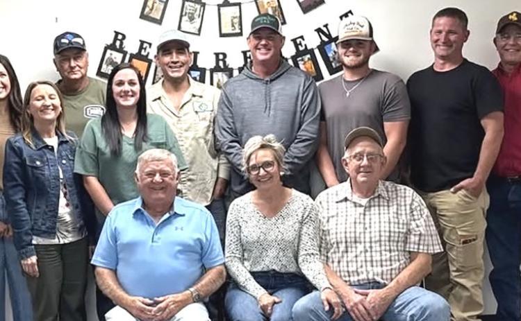 Danny Gray (front left) with his fellow GreenLight Gas staff members. COURTESY PHOTO