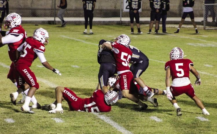 Wellington’s defense, including Jackson Jones (55), Miguel Rincon (5), Anthony Ortiz (15), Yobani Moreno (65) and Jovani Munn (67), down the Cyclones’ ball runner Friday, Nov. 11 in Memphis. The Red River Sun/Shauna Salinas