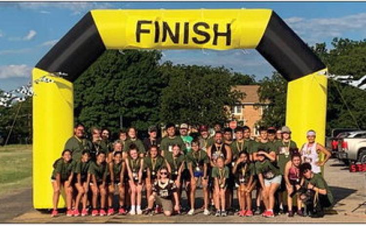 Nearly 35 participants join in the 7th Annual 5K and One Mile Run/Walk, hosted by the Memphis High School cross country team, alongside Coach Michelle Branigan, Saturday, Sept. 17. Photo Courtesy of Memphis ISD