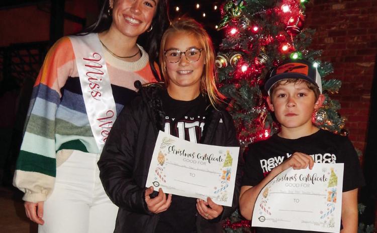 Miss Wellington 2022 Summer Owens congratulates Ava Kate Inman and Elijah Akeman, winners of the Collingsworth County Chamber of Commerce bicycle giveaway, during last year’s Lighting of the Square festivities. Presented by Collingsworth County Chamber of Commerce, the 2023 occasion is slated for 5:30-7 p.m. Saturday, Dec. 2. The Red River Sun/Bev Odom