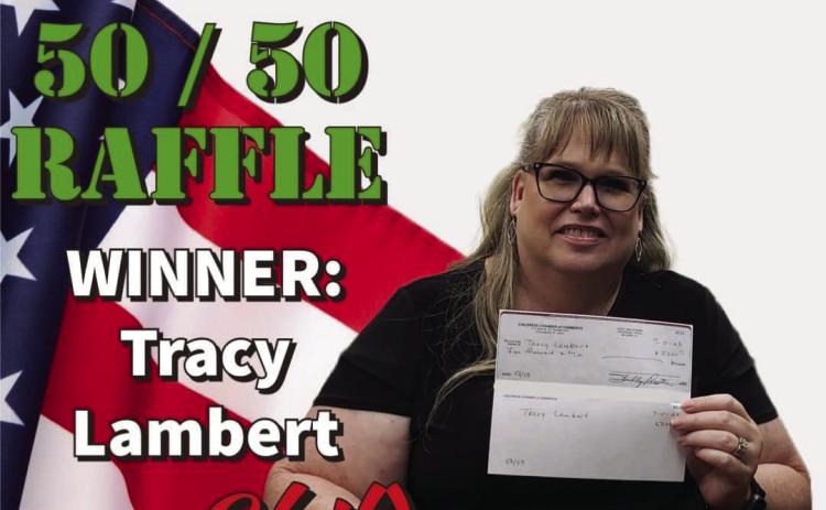 Tracy Lambert wins the recent Childress Chamber of Commerce 50/50 Raffle, collecting $5,000 in earnings, announced Tuesday, July 4 during the Fourth of July Party in the Park events. With only 200 tickets available for purchase, tickets were sold through the Childress Chamber of Commerce for $50. Photo Courtesy of Childress Chamber of Commerce