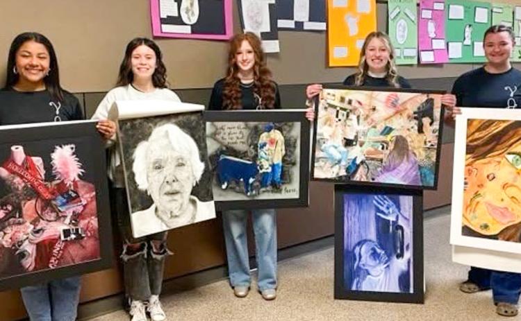 Wellington High School artists, including, from left, Jasmin Moreno, Rilynn Southerland, Bailey Page, Elli Ouellette and Jacy Lampe, exhibit their art pieces created for the recent Visual Arts Scholastic Event (VASE) competition in Amarillo. Wellington High School