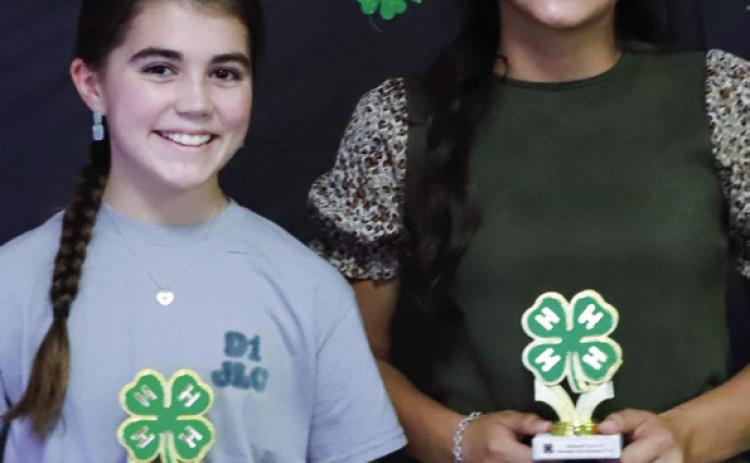 Quinn Roberson, left, accepts the Junior Gold Accomplishment Award, while Hazel Estrada receives the Intermediate Gold Accomplishment Award.