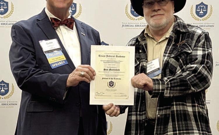 Lubbock County Judge Curtis Parrish, representing the Texas Association of Counties, presents Collingsworth County Judge Scot Martindale his Fellow of the Academy certificate. Texas Association of Counties