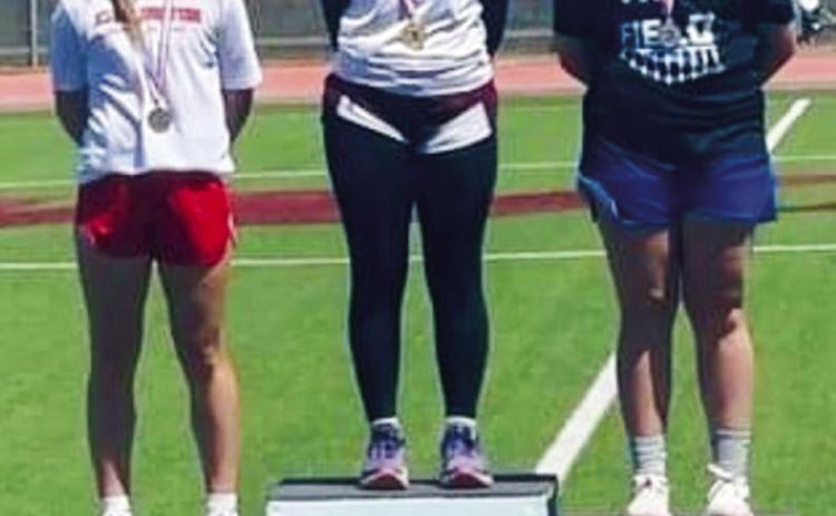 Junior Kaitlin Bawcom, left, throws bronze at the Region 1-2A Track and Field Championships Saturday, April 29 at West Texas A&amp;M University. Courtesy Photos