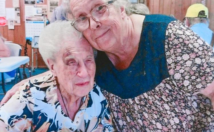 Betty Payton, left, who will be 100 in September, is welcomed to the Childress Senior Citizens Center’s weekly luncheon Thursday, June 26 by Childress Senior Citizens Center Board Chairperson Glenda Goundie. Payton said she enjoyed the dinner — a traditional Thanksgiving spread, including turkey and ham with the usual assortment of vegetables, condiments and desserts. The “icing on the cake,” she said, was conversations with other diners. Grace Holman