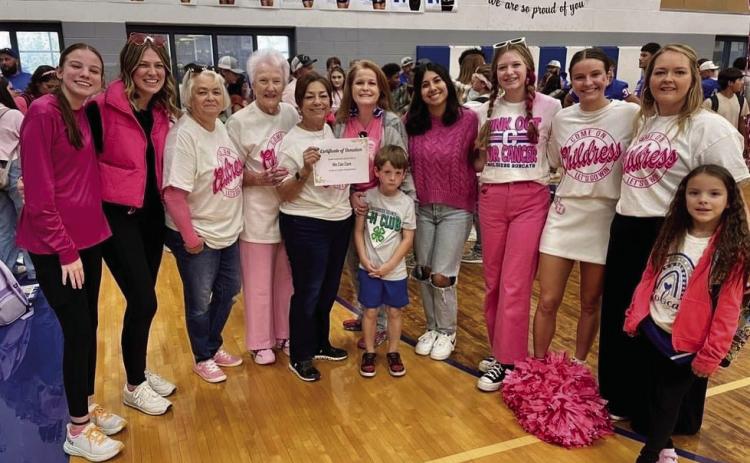 We Can Care’s Barbara Sue Parr, left, Carolyn Jennings, Sarah Haseloff, and Kimberly Hickman recently accept a donation from the Childress High School Student Council Friday, Oct. 7 in honor of Breast Cancer Awareness Month. Funds were raised through the sale of senior parking spots. We Can Care, a local nonprofit organization, aids Childress County cancer patients through the furnishing of gas cards. Courtesy Photo