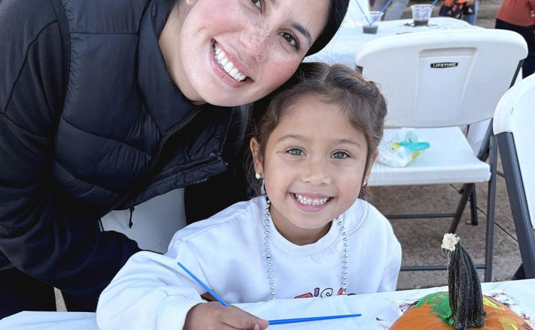 Taylor and Sofia Vitela enjoy the pumpkin painting at the museum during the annual Rocktober event in downtown Childress Saturday evening, Oct. 17. INTREPID PHOTO / AARON RAMOS