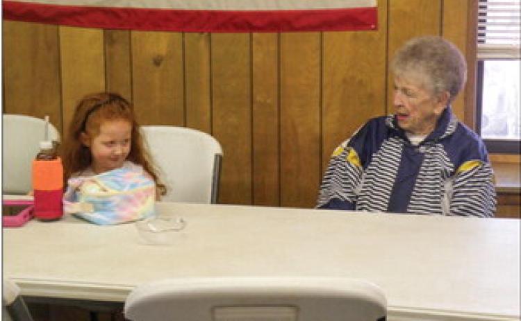Rylee Longbine, daughter of Jacob Longbine, talks with Anne Fromm at the recent Childress Senior Citizens Center weekly luncheon. Approximately 30 seniors attended the luncheon with numerous take-out orders. Childress Senior Citizens Center Director Glenda Goundie said that anyone – regardless of age – is invited. “Bring your favorite dish or make a donation or both,” Goundie said. Photo by Grace Holman