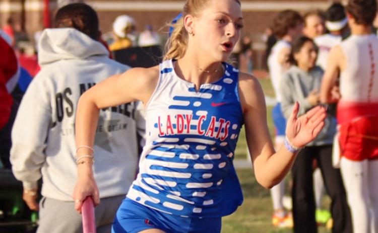 Childress’ Auburn Green aids the Lady Cats in first-place finishes in the 4x100-, 4x200- and 4x400-meter relays during the Rocket Relays Thursday, March 12 in Wellington. Childress High School Yearbook