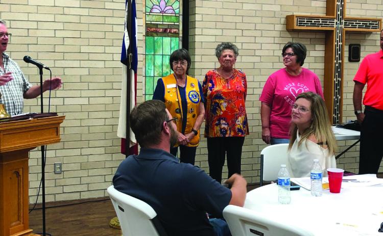 Lion Neal Odom, left, leads in singing “Happy Birthday” to Nita Day, Fraya Hammons, Lori Moore and Gene Pena during the Sept. 19 meeting with guests Brandon Powers and Nicole Tyler. The Red River Sun/Bev Odom