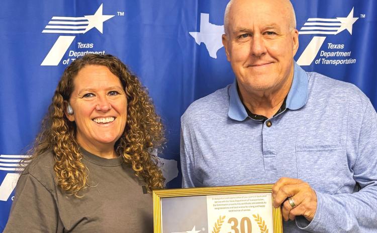 One of 10 recipients, Shari Thomason, Childress District Lab, is presented a 30-year service award by Childress District of the Texas Department of Transportation Engineer Darwin Lankford Thursday, May 21. “I appreciate the dedication each of these employees has given not only to the district, but to the state of Texas,” Lankford said. TEXAS DEPARTMENT OF TRANSPORTATION