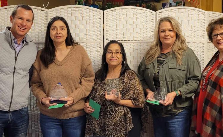 Preferred Management Corporation Vice President Jared Chanski, left, and Collingsworth General Hospital (CGH) Administrator Candy Powell, right, recognize Brenda O’Rear for 30 years of service to CGH, Crecelia Gutierrez for 20 years and Vikki Barton for 25 years. Courtesy Photos