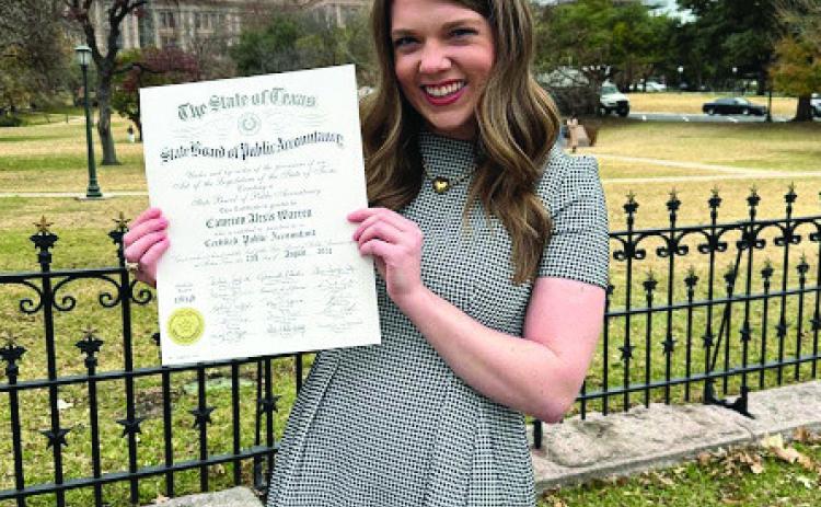 Employed by Greenbelt Electric Cooperative, Inc., Cameron Warren receives her Certified Public Accountant certificate during a January ceremony at the Palmer Events Center in Austin. Courtesy Photo
