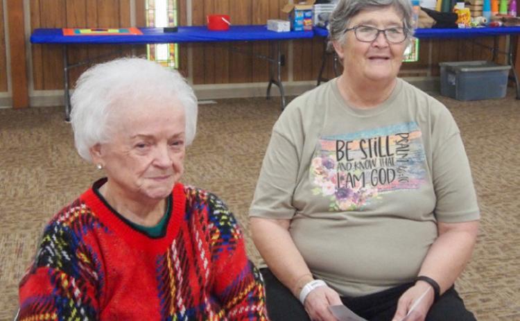 Linda Rothwell, left, plays “Nativity Story Left, Right,” led by Sabrina Landrum, at the monthly Adult Fellowship Luncheon Thursday, Dec. 14 at the Childress Methodist Church Fellowship Hall. Landrum’s program for the season featured a Christmas quiz and information about the carol “The Twelve Days of Christmas.” Photo by Grace Holman