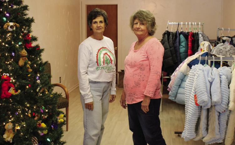 Childress County Christmas Sharing (CCCS) volunteers Raenell Smith, left, and Durlene Worthington display coats that will be given to those in need this holiday season. Currently accepting applications, families are encouraged to sign up at the CCCS office, located at 232 Main St. The Red River Sun/Elizabeth Tanner