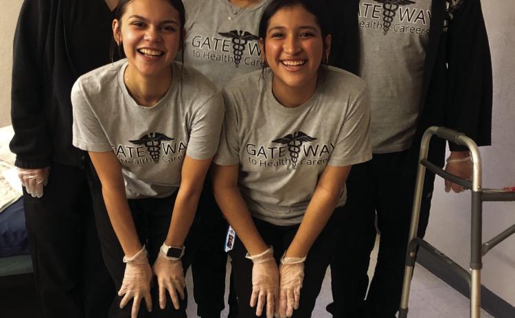 Wellington High School Class of 2025 Health Science students experience hands-on training at Wellington Care Center to earn their 40 clinical hours required for their Certified Nurse Aid Certification. Front row, from left: Kendra Molina, Christell Melendez. Back row, from left: Kenzi Ballinger, Jelly Garcia, Benji Garcia. The Red River Sun/Bev Odom
