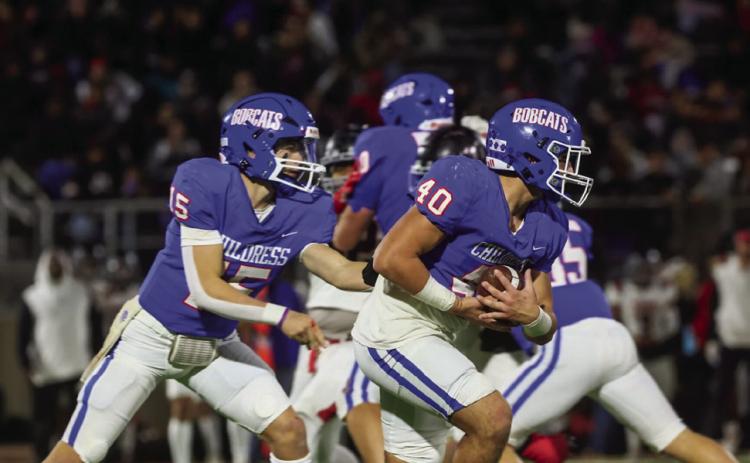 Childress quarterback Drake Rabe hands the ball off to Colton Teichelman in the Bobcats’ Class 3A Division II Bi-District Championship win over Slaton Friday, Nov. 15 at Charles Tyer Stadium in Floydada. Press Pass Sports/Nicole Dill