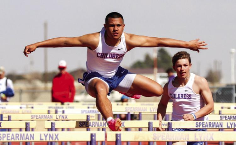 Childress’ Isaiah Jalomo competes in the 110-meter hurdles at the Spearman Lynx Relays Thursday, March 30 at Lynx Stadium. Through the Lens of Liz/Elizabeth Oronia