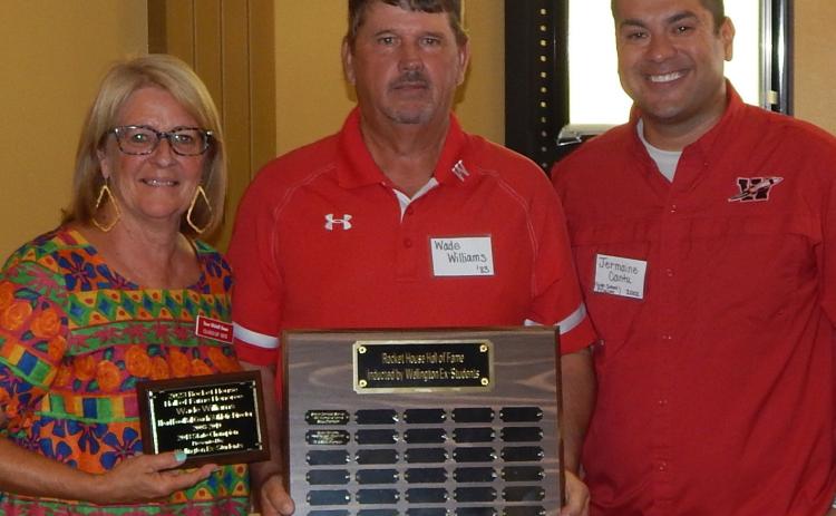 Wade Williams accepts the 2023 Rocket House Wall of Honor merit from Renee Hanna, left, and Jermaine Cantu. The Red River Sun/Bev Odom
