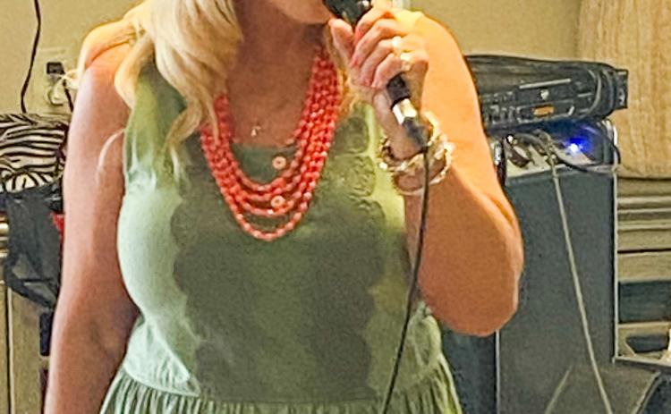 Melissa Kiker brings praise music to Wellington Care Center with her music ministry Sunday, Aug. 20. She commented that she and the Lord brought 14 songs to six residents and a guest, Sandy Sain. “It was such a blessing today,” Kiker said. Her husband, Lon Kiker, helped her load the music. Courtesy Photo