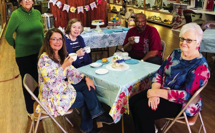 Collingsworth County Museum volunteer Glenda Anglin, left, and curator Karen Caldwell visit with guests Sharon Venable, Robert Powell and Nancy Harris during the afternoon tea party on Friday, March 17. “All in attendance had a good time,” Caldwell said. “If you still haven’t had a chance to see our great little doll exhibit, come on by! We have over 100 dolls on display.” The Red River Sun/Bev Odom