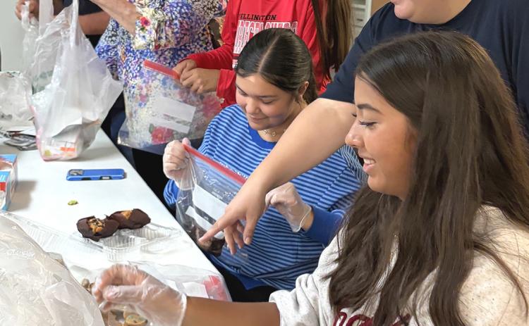 Leos assist Wellington Lions with Snack Pack assembly