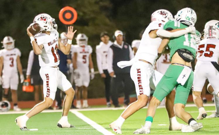 Wellington’s Callen Kane looks to throw a pass downfield during a District 5-2A Division II game Friday, Oct. 25, 2024, at El Paso Field in Shamrock. Amarillo Globe-News/Amy Pham