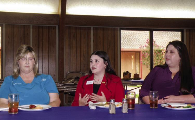 Childress High School’s Kimi Ward, a National Family, Career and Community Leaders of America (FCCLA) Officer, speaks at the September Adult Fellowship Luncheon at Childress Methodist Church. With her are her grandmother, Mary Ann Ward, left, and her aunt, Megan Trussler, right. Ward described the objectives of FCCLA, both within the organization and the community at large, as well as her duties as the Vice President of Public Relations.
