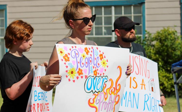 Community members organized a peaceful protest due to the recent evictions of residents at the 75-unit Madison Chase apartment complex Friday, July 10. ELIZABETH TANNER/THE GREENBELT INTREPID