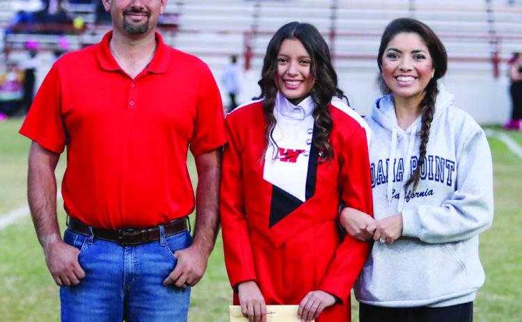 Prior to the final home football game, Wellington High School recognized seniors active in football, cheerleading and band Friday, Oct. 25. Noemi Arianna Pena is the daughter of Gene and Noemi Pena. She has been a member of the Rocket Regiment for five years.
