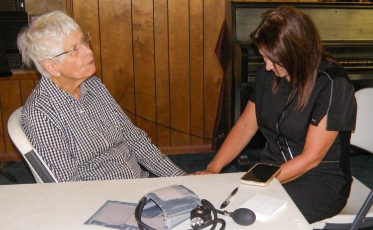 Nurse provides health checks