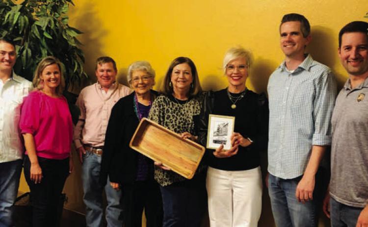 Wellington Ritz Theatre Board of Directors honor outgoing President Margret Wood with a gift of gratefulness during the Mardi Gras Meal and Bingo 2023, an event to thank sustaining members for their support, at 6:30 p.m. Thursday, Feb. 23. Wood served as president from 2016 until October 2022, when Lyndy Forrester-Black assumed the role as board president. From left: Luke and Amy Inman, Taylor Allred, Katherine Reeves, Wood, Forrester-Black, Kenny Keys, Ethan Cole. The Red River Sun/Bev Odom