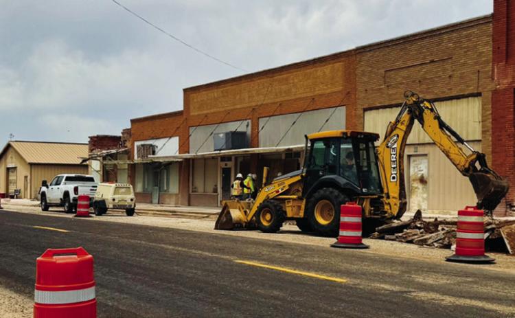 Construction crews work on demolishing sidewalks on the northside of FM 338 through Dodson back in May. Photos Courtesy of Jim Ellis