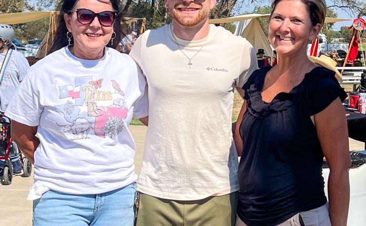Wellington State Bank, represented by Odilia Cantu, left, Rowdy Duncan and Veronica Gray, receive first place in the Fifth Annual Rocky Sprott Living History Chili Cookoff. Sons of Confederate Veterans