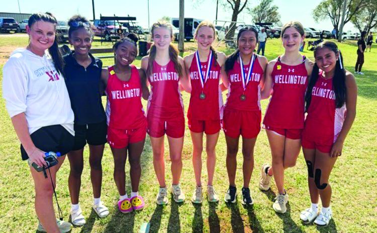 The Wellington Lady Rockets will compete at the Region 1 Cross Country Championships Monday, Sept. 21 at Mae Simmons Park in Lubbock. From left: Coach Savannah Henderson, Angela Lewis, Aleah Lewis, Addalyn English, Taytum Kane, Leslie Orozco, Anna Henard, Sabrina Segovia. Courtesy Photos