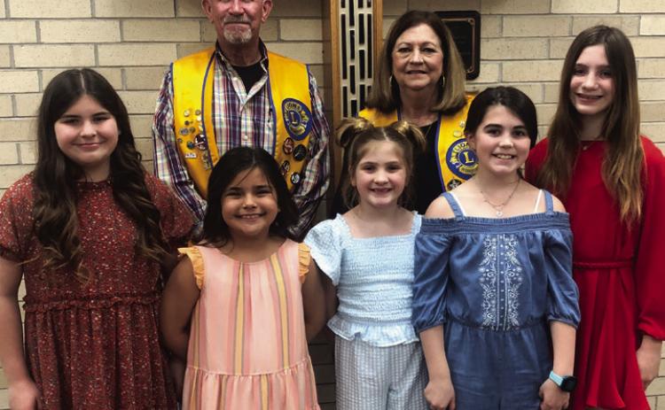 Wellington Boss Lion Jeff Thomas and Lion Margret Wood, back, welcome guests Rachel Strickland, Tylee Wiebe, Evelyn Henard, Quinn Roberson and Anna Henard to the Monday, Feb. 20 meeting of the Wellington Lions Club. The fourth-grade students each presented a University Interscholastic League (UIL) Oral Reading selection. Seventh-grader Anna Henard gave an impromptu speech on a random subject. The Red River Sun/Bev Odom