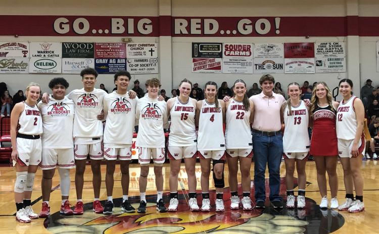 Wellington High School basketball seniors take center court for recognition Friday, Feb. 12 between the Lady Rocket and Skyrocket games versus Quanah. The Lady Rockets won 39-22, and the Skyrockets came out on top 48-33. From left: Presley Kane, Fabian Pina, Bryant Tarver, Braylon Tarver, Carson Tarver, Briley Waters, Charley Wilbur, Audrey Jones, Gatlin Guy, Kaitlin Bawcom, Kendra Bawcom, Abby Garcia. The Red River Sun/Bev Odom