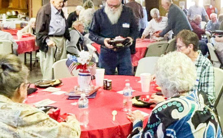 Folks embrace the fellowship during the Saturday evening, April 4 Quail Ex-Student Reunion at the Quail Community Building. Clockwise, from left: guest Sharon Starkey, of Wellington; Troy Harrison, of Amarillo; Bobby and Anita Dodez, of Texarkana; Vada Bell Wood, of Wellington. COURTESY PHOTO