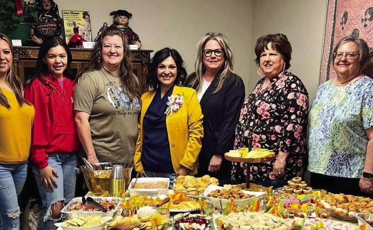In honor of Wellington Professional Women’s Club Woman of the Year Becky Reyes, members, including Glenda Anglin, left, Kasey Rodriguez, Kaycee Martinez, Carrie Martinez, Reyes, Vikki Barton, Candy Powell, Cheryl Tarver and Alicia Parks, pause prior to Tea for Me Friday, April 21 in the Ellis Art Center of the Collingsworth County Museum. Courtesy Photo