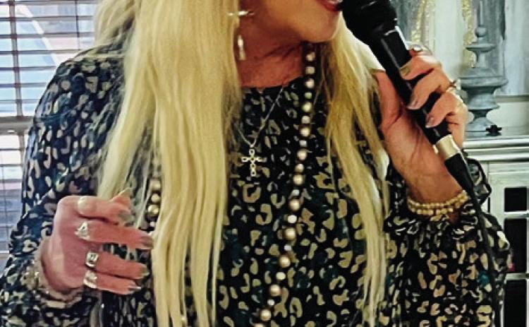 Vocalist Melissa Kiker spent a recent Sunday afternoon singing patriotic and Thanksgiving selections at Wellington Care Center. Courtesy Photo