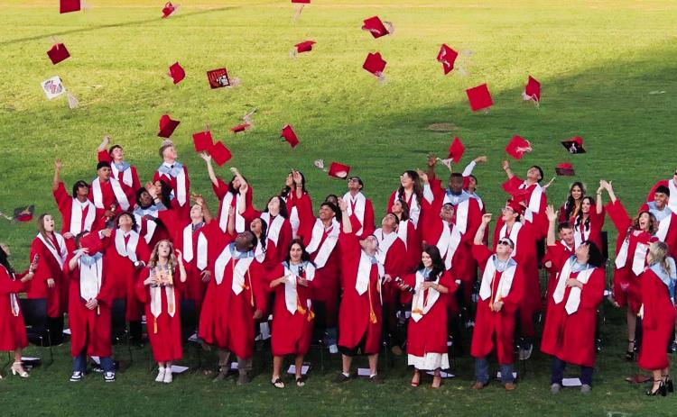 Wellington High School Class of 2025 graduates toss their caps in celebration of receiving their diplomas following the 7 p.m. ceremony Friday, May 16 on Powell Field at Skyrocket Stadium. The Red River Sun/Bev Odom