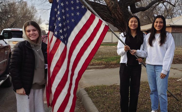 Leo Club officers, including, from left, Vice President Currie Forrester, Secretary Leslie Rodriguez and President Christell Melendez, assist Collingsworth County Chamber of Commerce with placing American flags across Wellington Monday, Feb. 17 for President’s Day. “I love their willingness to help out and volunteer when needed!” said Noemi Pena, one of four Leo Club Advisors for Wellington Lions Club. Photo Courtesy of Wellington Lions Club