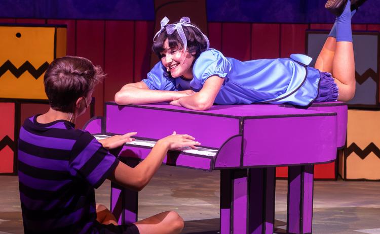 Schroeder and Lucy, portrayed by Atticus Lee and Kennedy Cardenas, embrace an intimate conversation as he performs a tune on his piano during the Amarillo Little Theatre Academy production, “You’re a Good Man, Charlie Brown.” The Wellington Ritz Theatre welcomes the production with a 2 p.m. and 7 p.m. show on Saturday, July 25. For reserved seats, $20 for adults and $12 for students (three and up), call 806-447-0090 or visit wellingtonritztheatre.com. VENICE MINCEY PHOTOGRAPHY