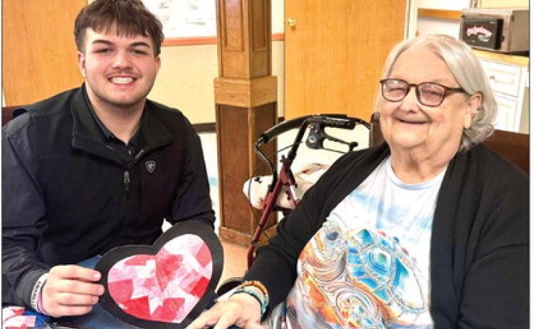 Memphis High School National Honor Society members share the love at Memphis Convalescent Center Wednesday, Feb. 11, stopping by to complete a Valentine’s Day craft with residents. Memphis Convalescent Center